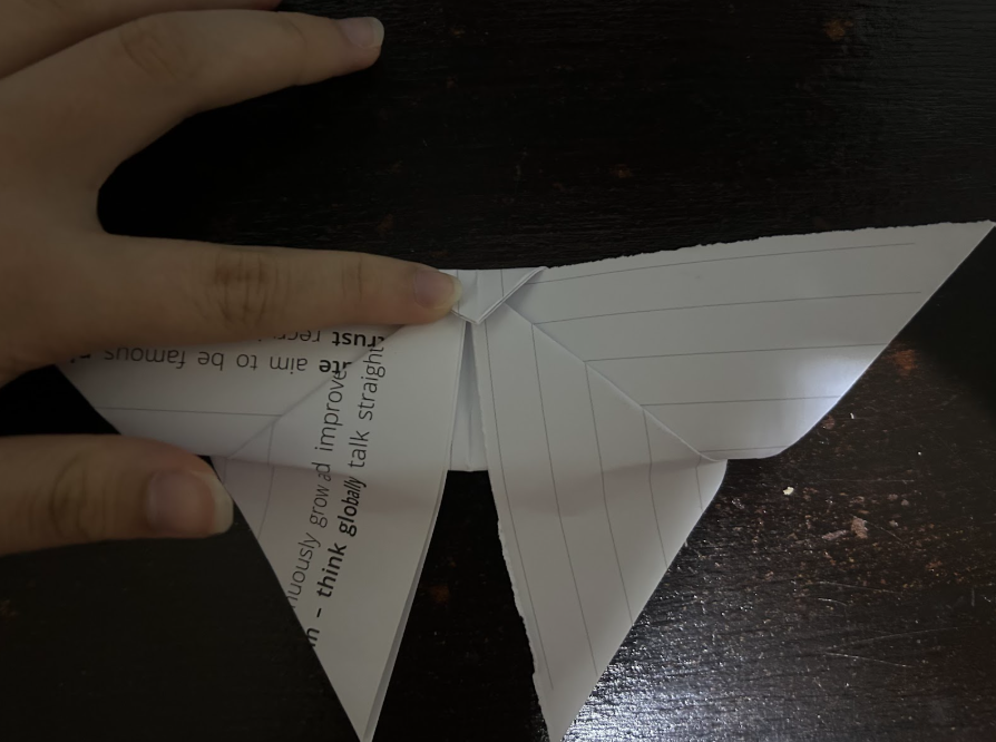 Folding top corners to center