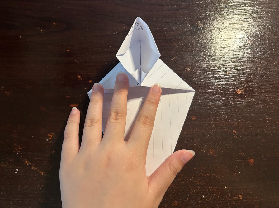 Folding top corners to center
