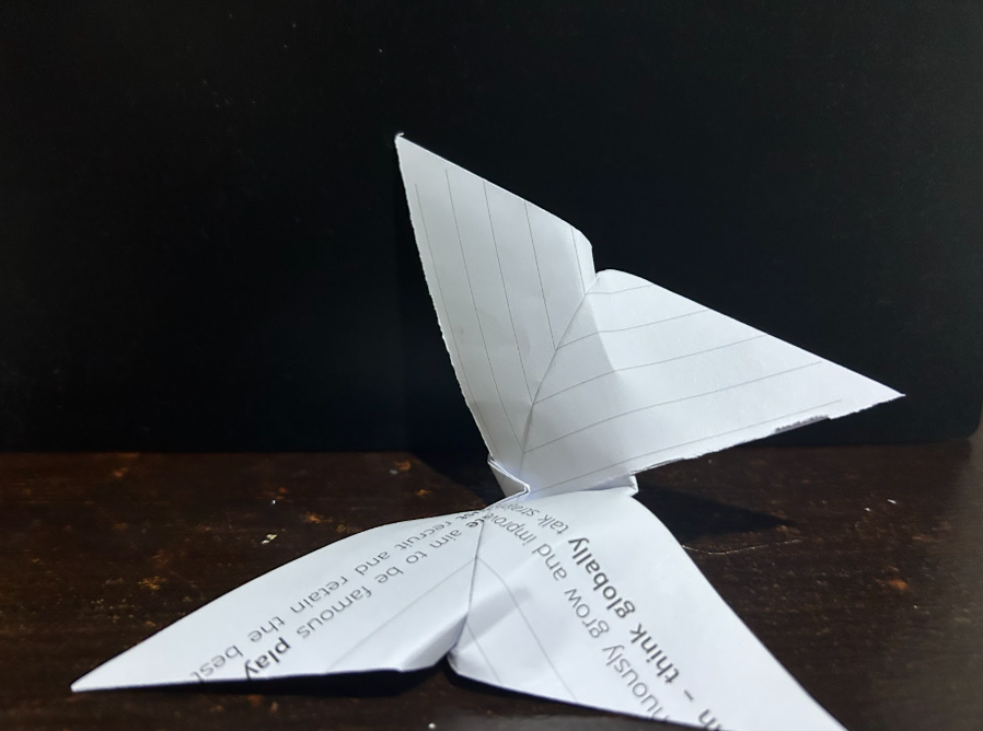 Folding top corners to center
