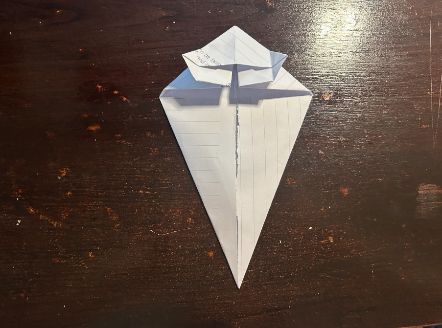 Folding top corners to center