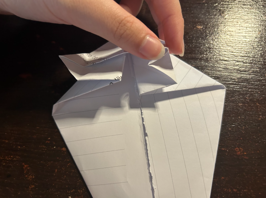 Folding top corners to center