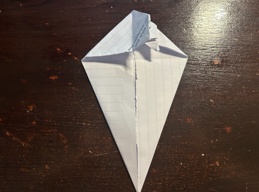 Folding top corners to center