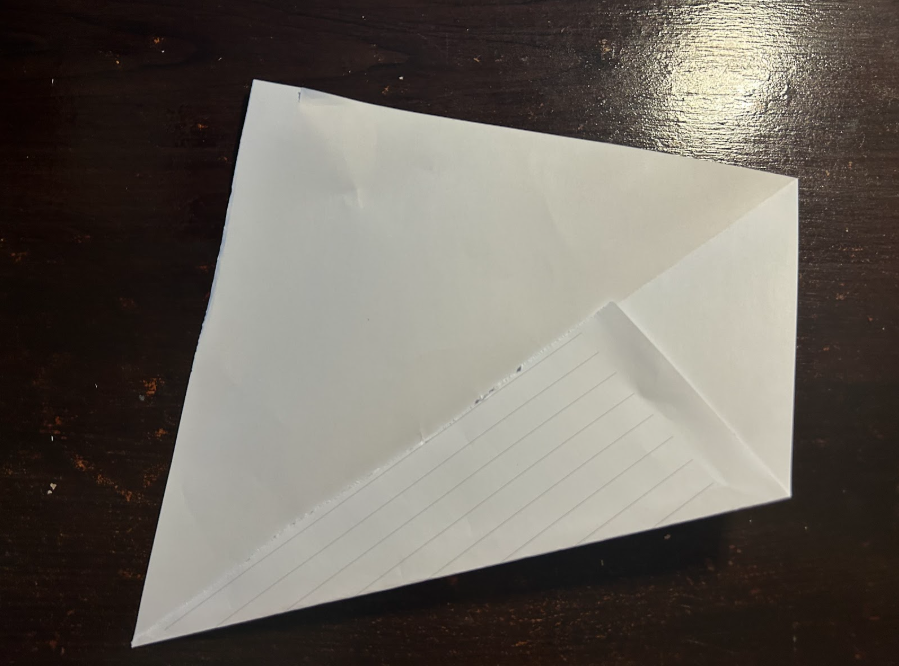 Folding top corners to center
