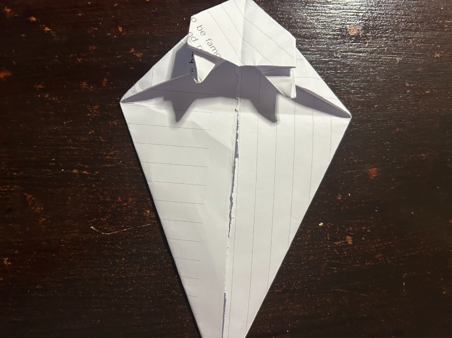 Folding top corners to center