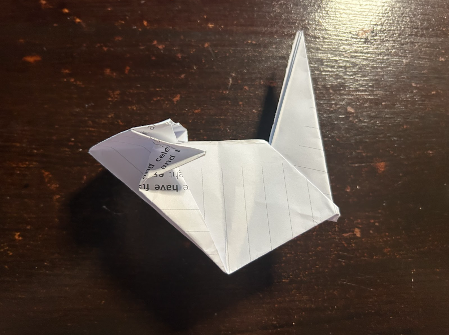 Folding top corners to center