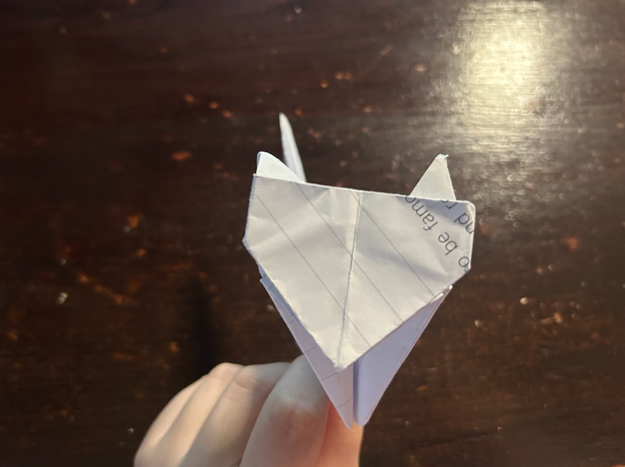 Folding top corners to center