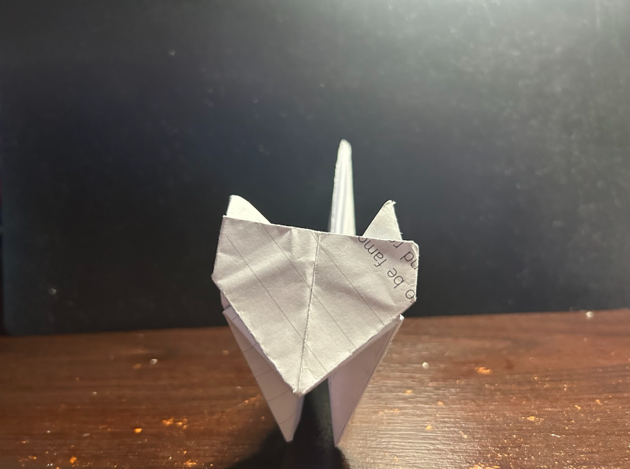 Folding top corners to center