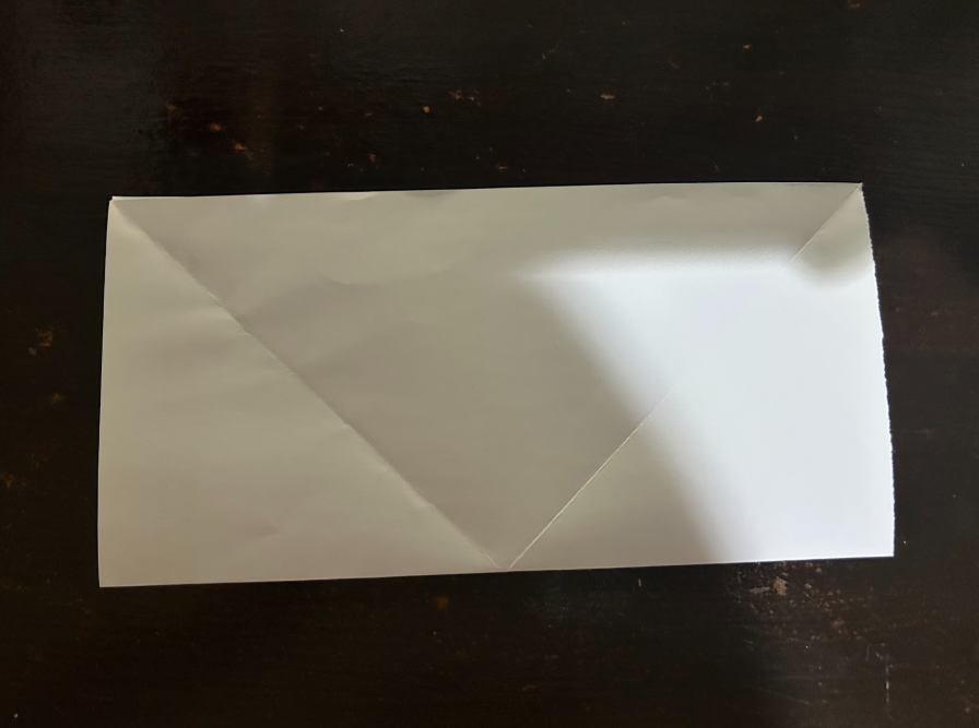 Folding top corners to center