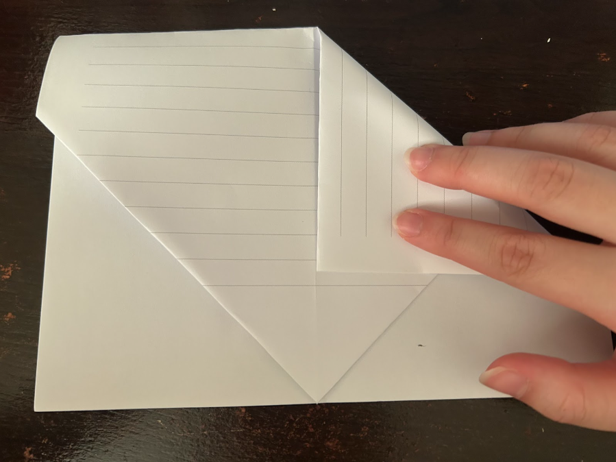 Folding top corners to center