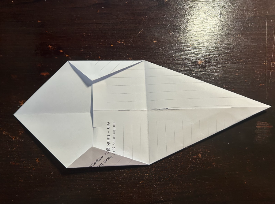 Folding top corners to center