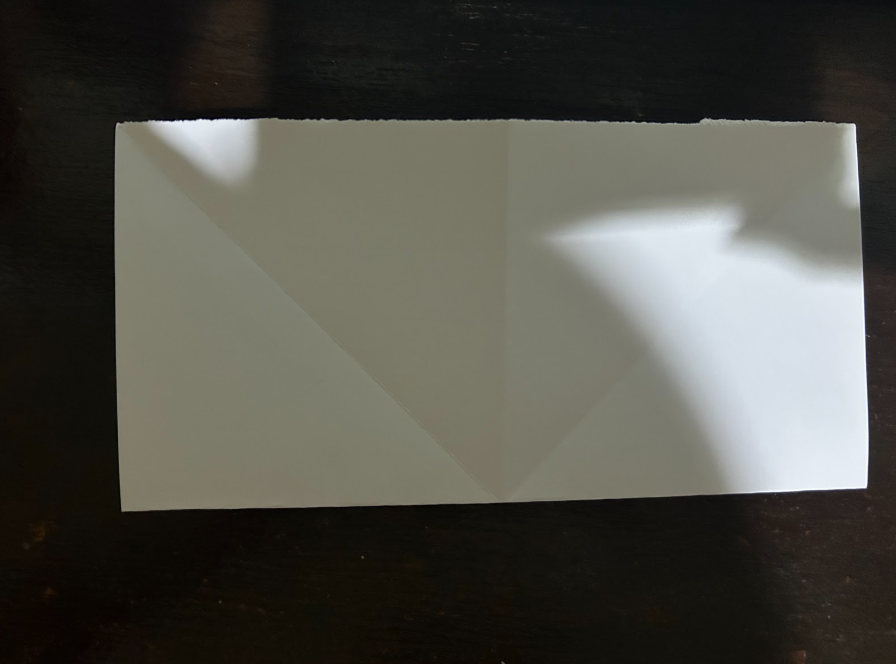 Folding top corners to center